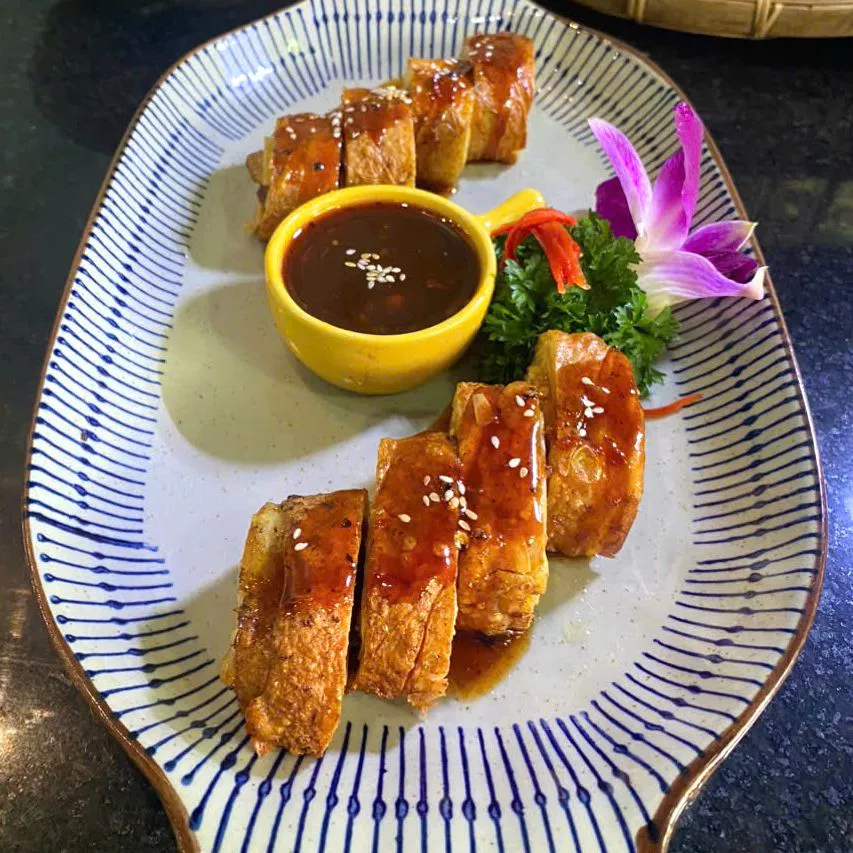 Mì Quảng noodle bowl with sesame rice cracker — Da Nang Bib Gourmand dining
