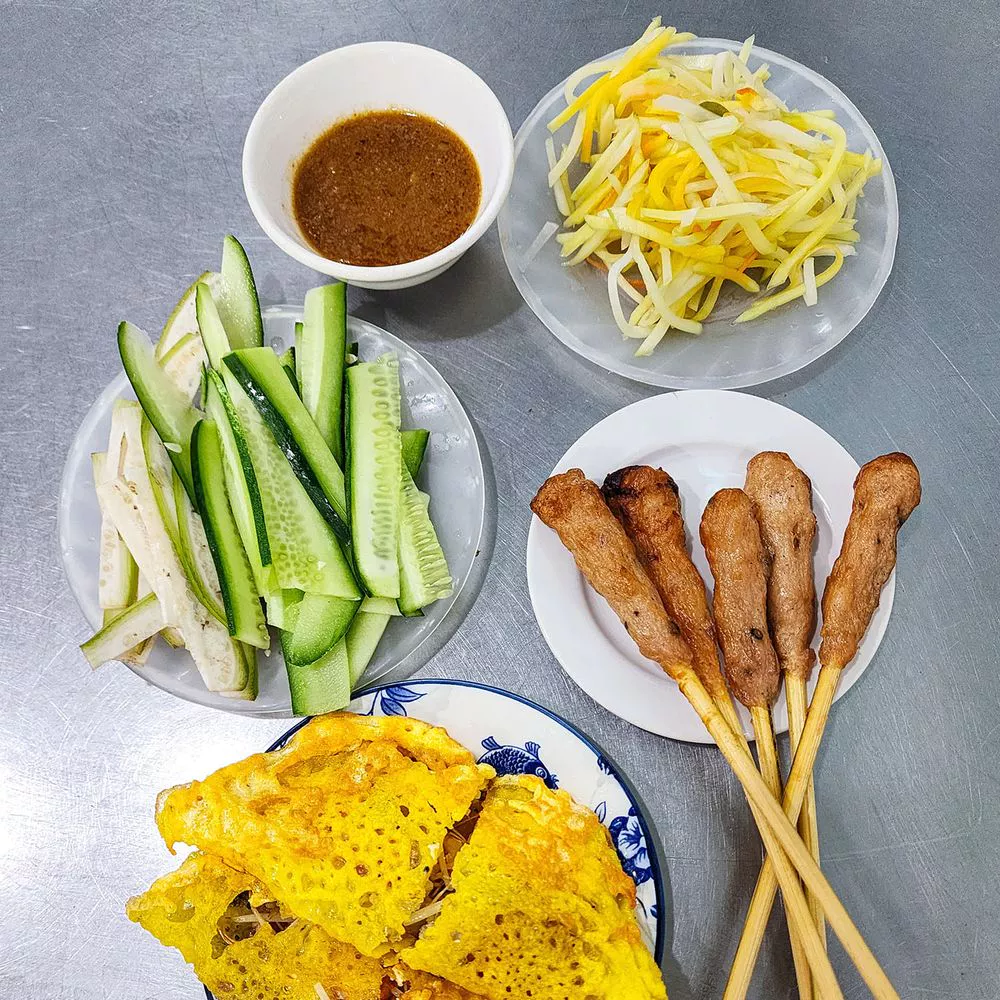 Bánh xèo crispy rice crepe with nem lụi pork skewers — Bánh Xèo Bà Dưỡng, Da Nang Bib Gourmand