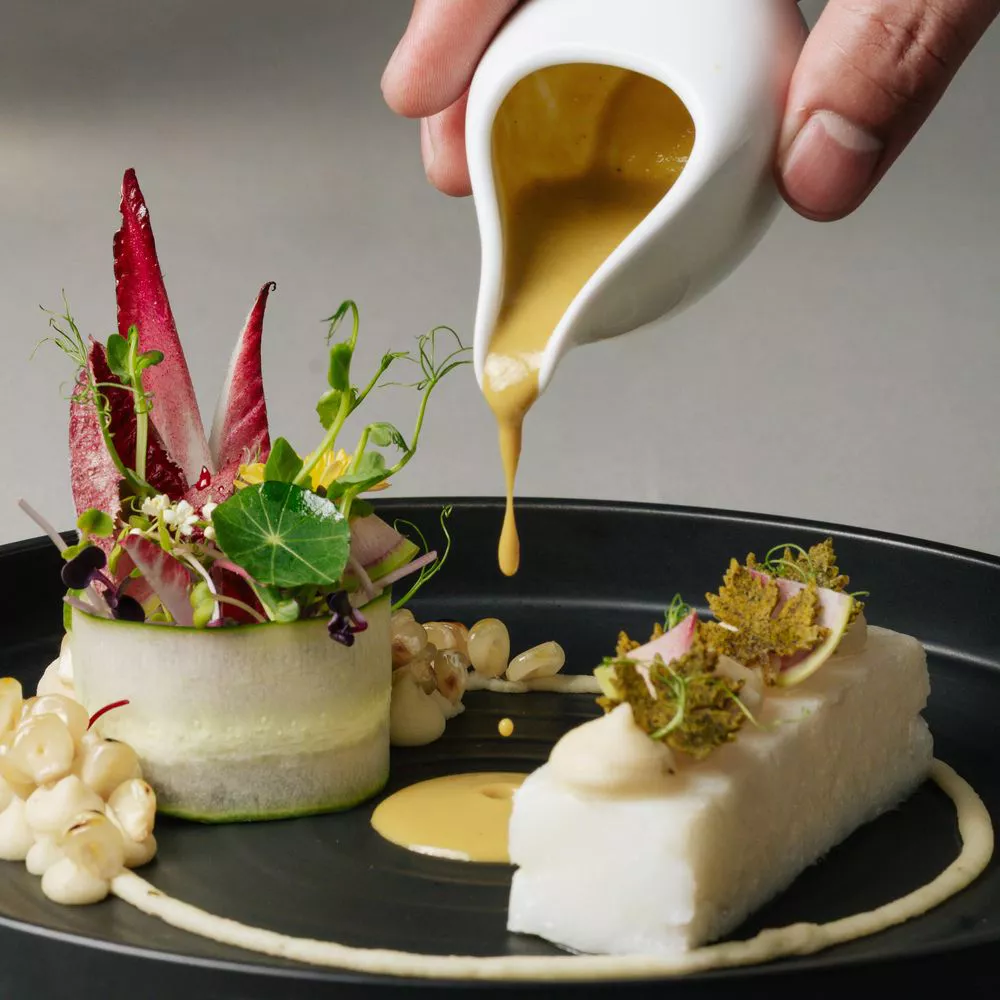 The Temptation fine dining plated fish dish — MICHELIN Selected Da Nang