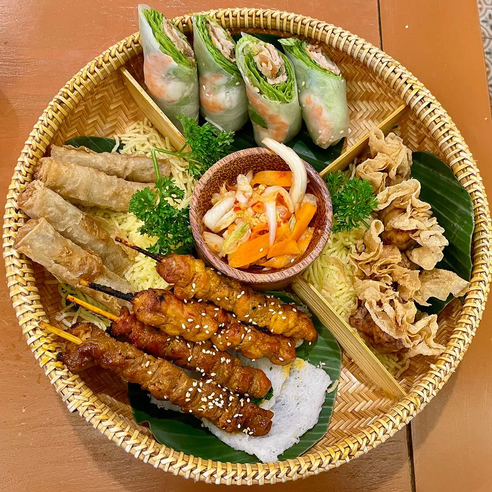 Bếp Cuốn Vietnamese spring roll and skewer platter — MICHELIN Selected Da Nang 2025