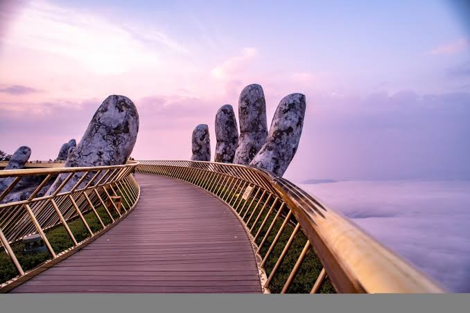 The Golden Bridge at Ba Na Hills, held aloft by giant stone hands above the forested ridge