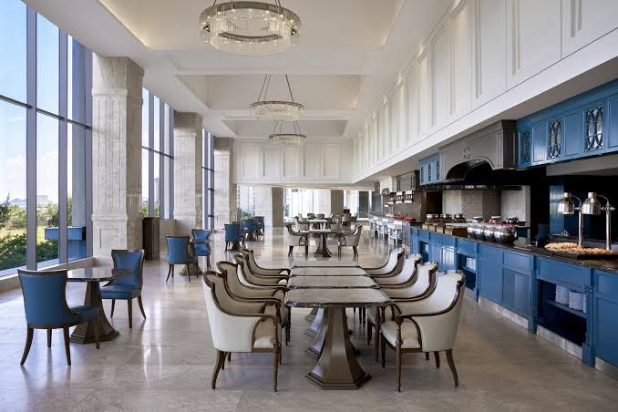 The breakfast restaurant at Four Points by Sheraton Danang, with the live cooking stations along the back wall