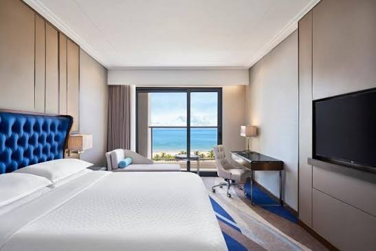 An ocean-facing room at Four Points by Sheraton Danang, with a view of My Khe Beach through the window