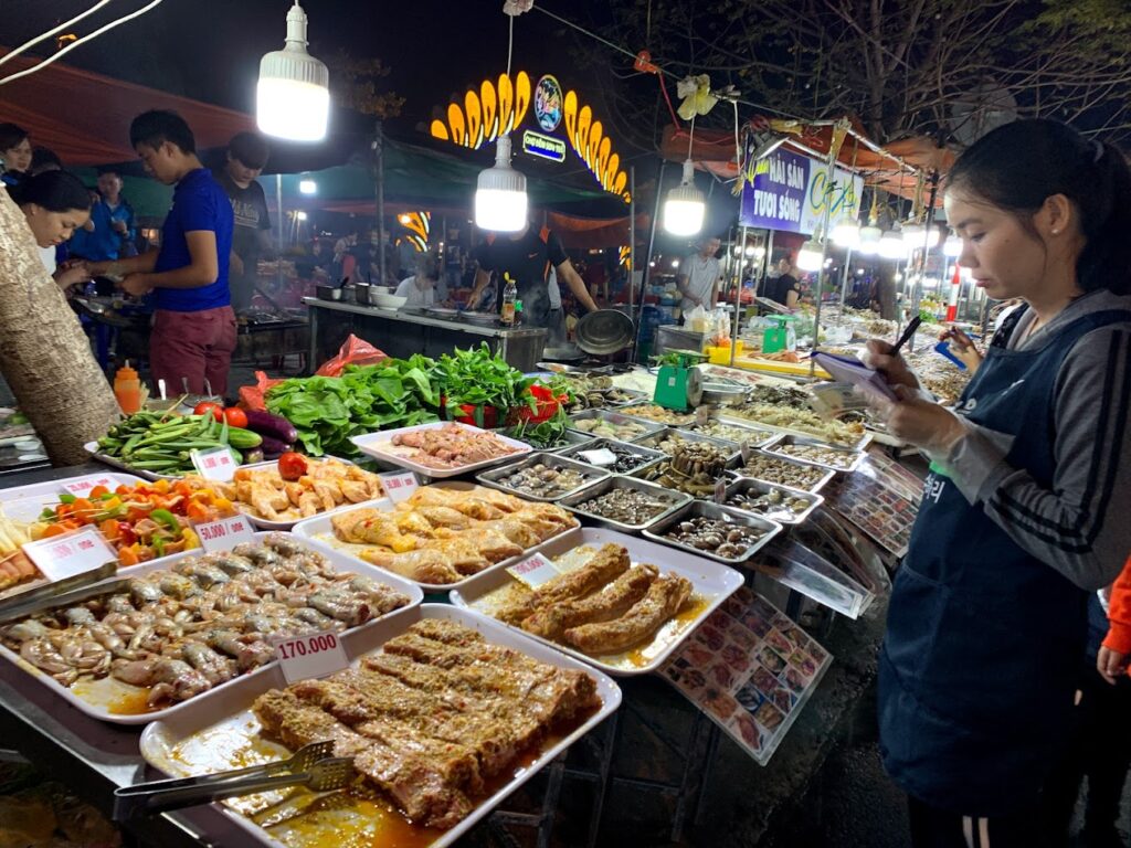 Da Nang night market with lights and street food stalls