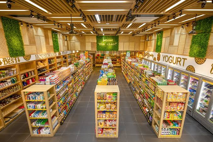Vietnamese convenience store aisles stocked with groceries and household items