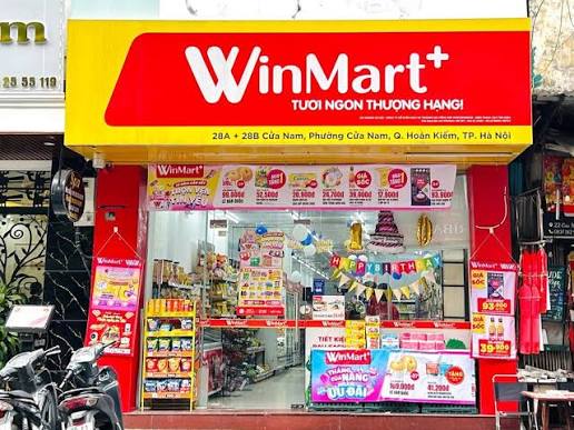 Vietnamese convenience store shelves stocked with drinks and snacks